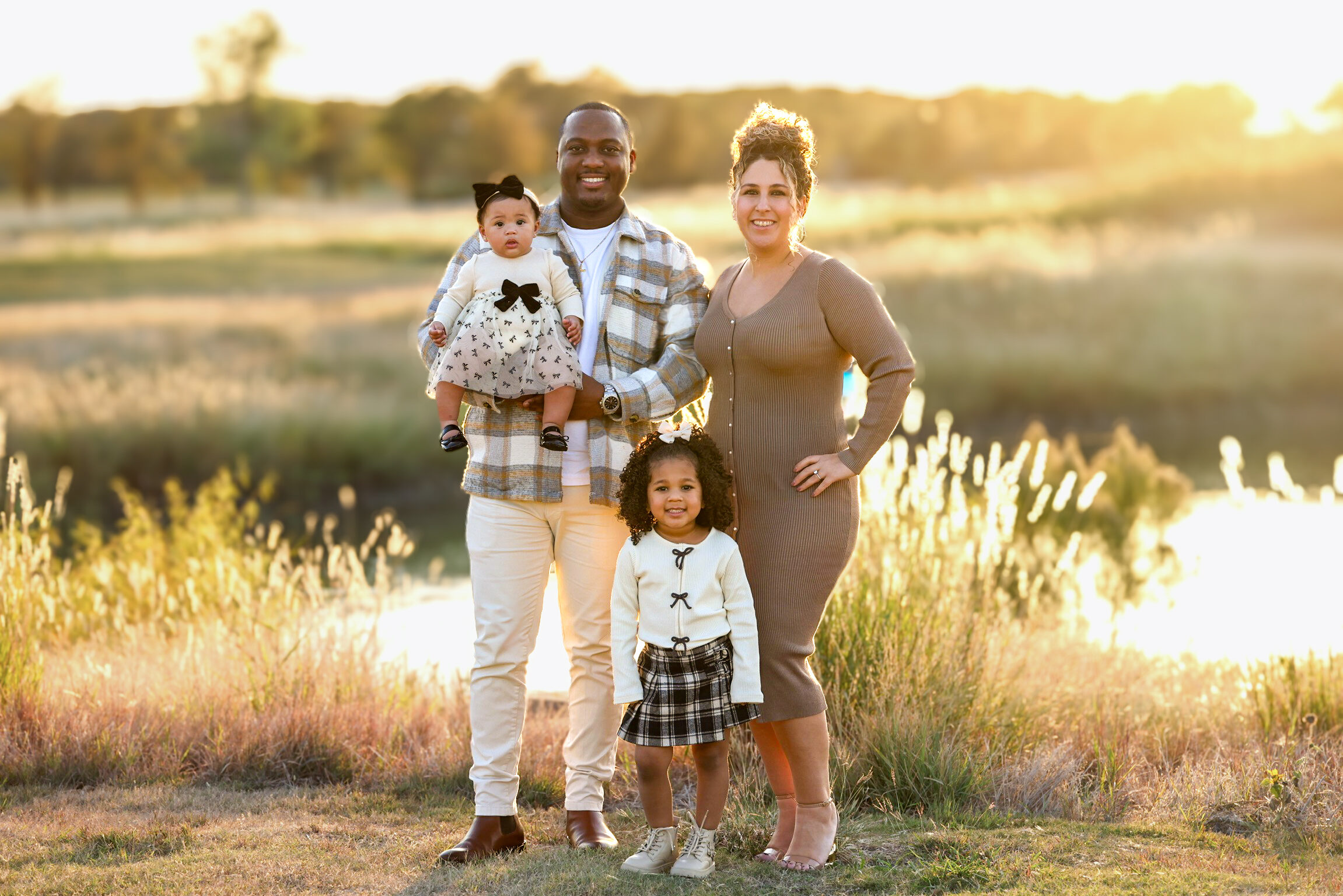 Family portrait at sunset field